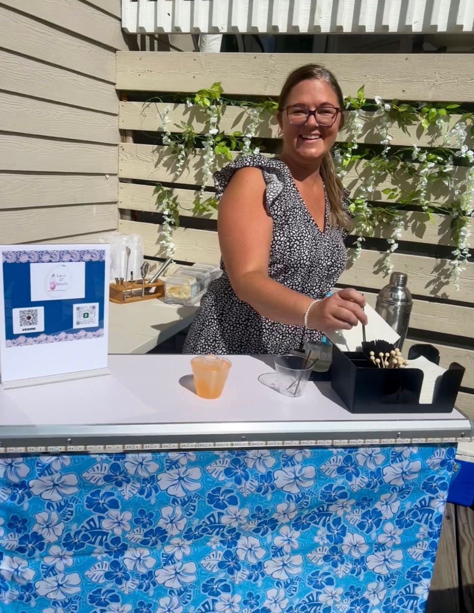 Lacey bartending at a Lace & Beads event