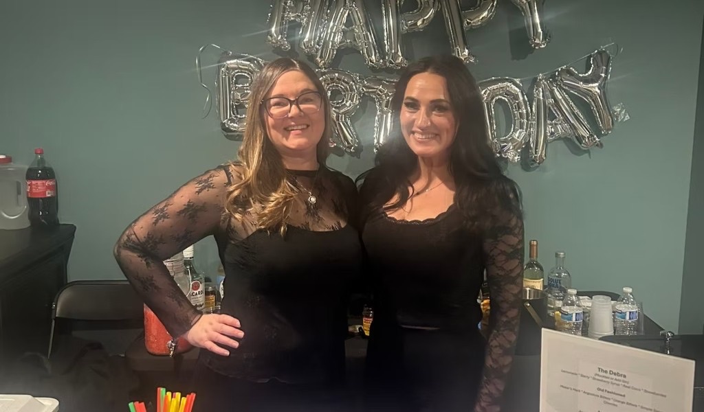 Lacey and Melissa of Lace & Beads behind the bar at an Ann Arbor birthday event